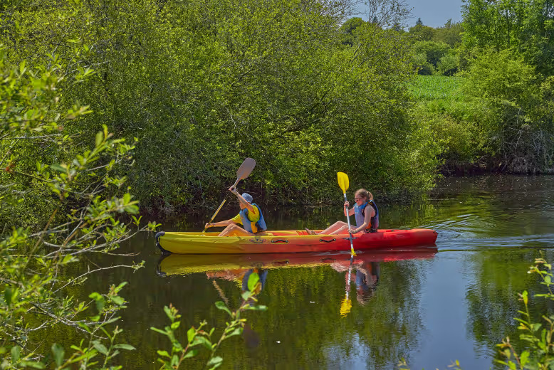Canoeing on the River Ellé near Le Ty Nadan, a Eurocamp parc in Brittany